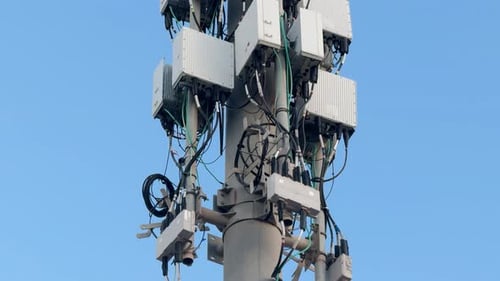 Close-up of communication antenna for 4G and 5G networks. Camera tilt up.