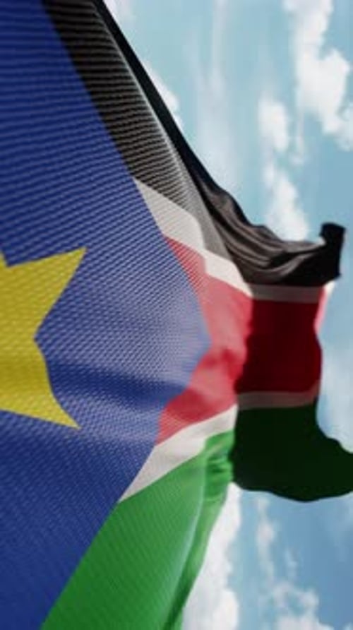 Realistic South Sudan Flag Waving Against Blue Sky Animation