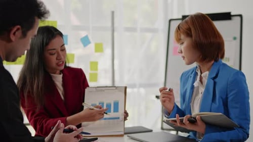 Team Discussing Data at Office Meeting