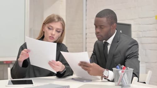 Business People Doing Paperwork in Office