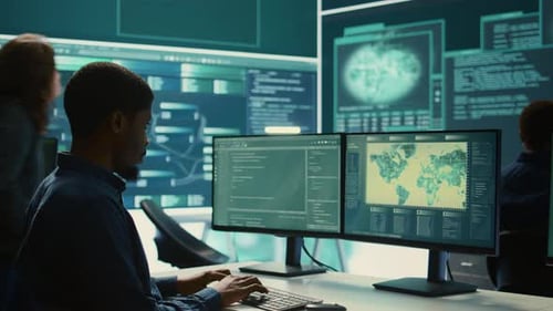 Man Working on Computer in Tech Office