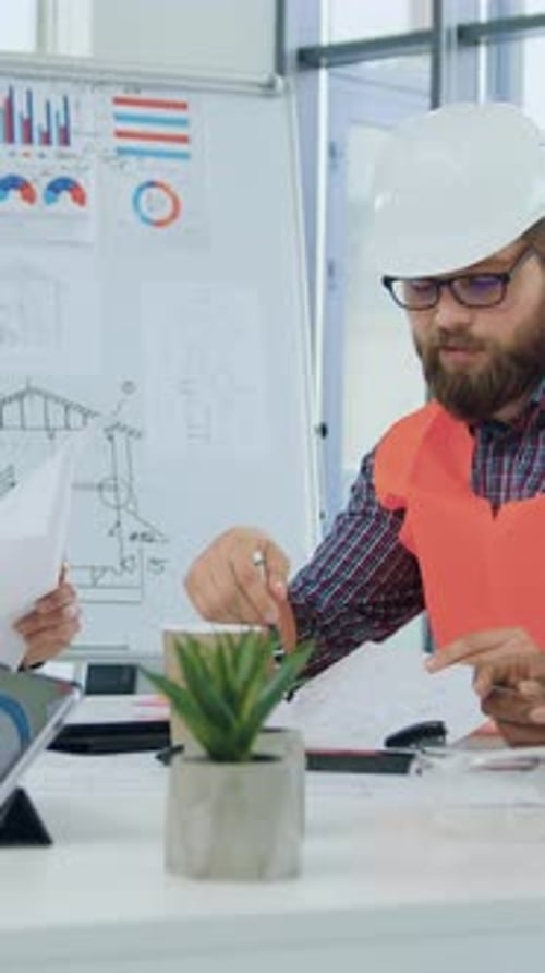 Likable Experienced Confident Male and Female Specialists in Building Industry Gathering Together in