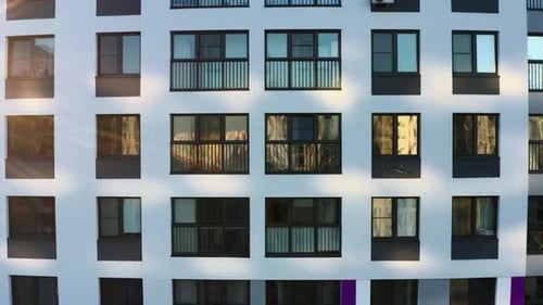 Dark Windows of the White Multistorey Building Stock Footage Aerial View of an Apartment Residential