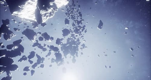 Asteroid Field Surrounded By Stars in Deep Space with Bright Celestial Light