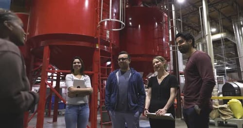 Team of people meeting in industrial setting