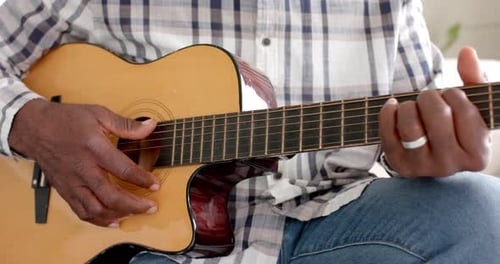 Senior Adult Plays Acoustic Guitar