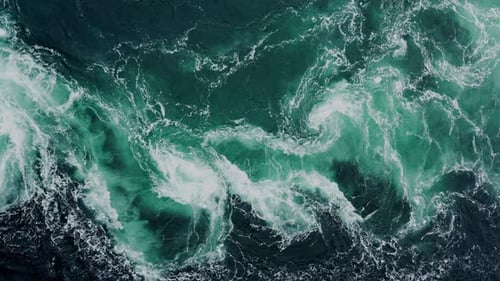 Drone Video with Birdseye View of the Abstract and Powerful Water Currents Rapids and Whirlpools of