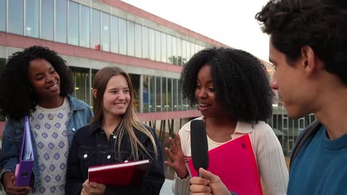 University Students Interviewing Classmate on Campus