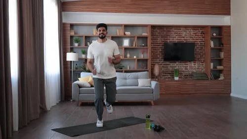 Man Exercising at Home on Yoga Mat