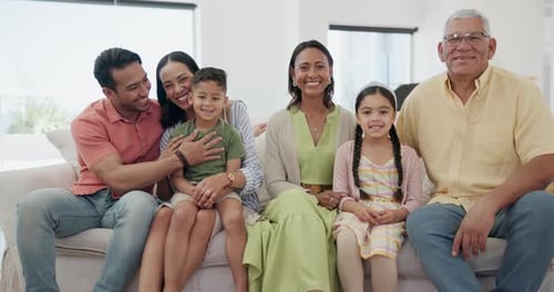 Smiling Family Portrait on Couch