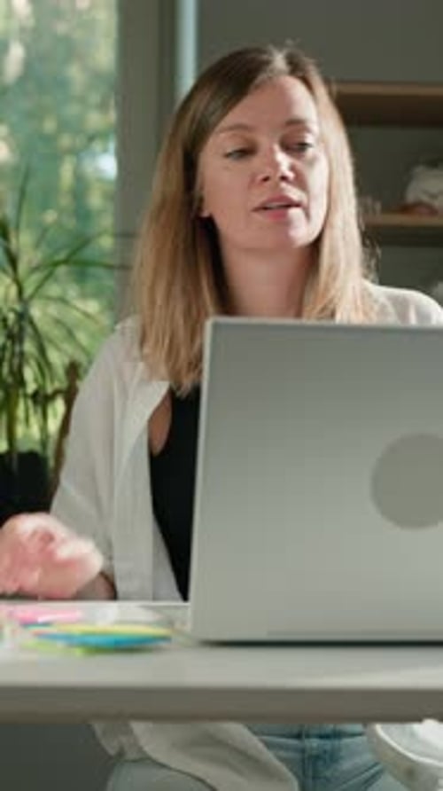 Woman Working at Home Closing Laptop