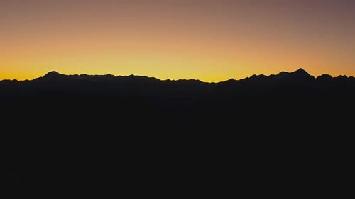 Dark Silhouette of Mountains and sunset. Mountain peaks Dolomites. Brenta, Italy