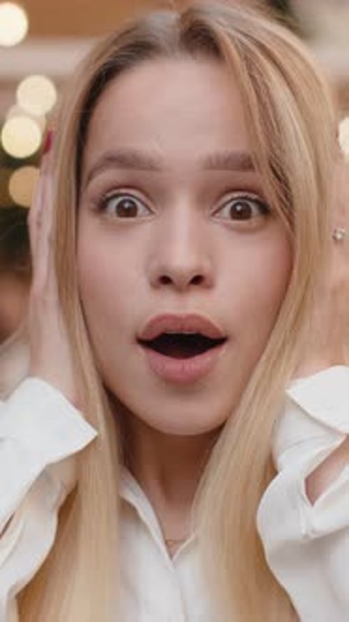 Young Woman Looking Surprised at Camera Shocked By Sudden Win Good Victory News Wow in City Street