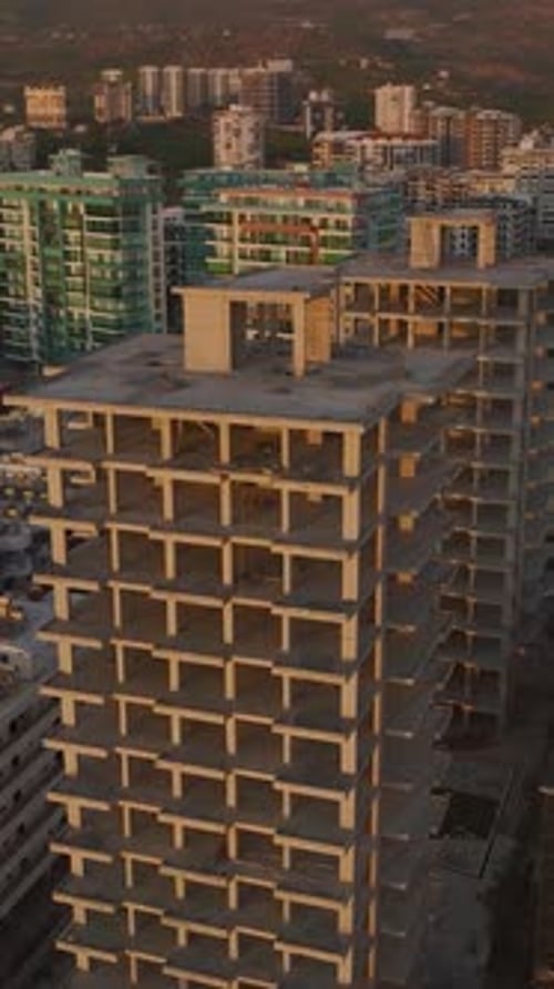 Vertical Video Scenic Coastal Framework Rises for a Luxury Residential Building on the First