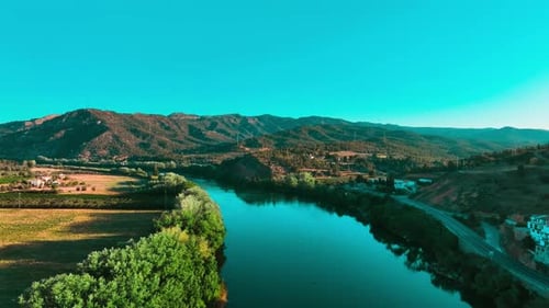 From a drone view we can see the river of the Ebro delta with landscapes and birds fluttering throug