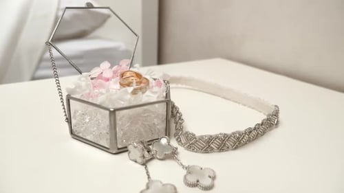 Wedding Rings and Jewelry on White Table
