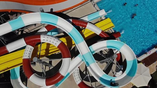 drone view of people swimming in aquapark and pool