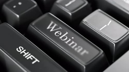 Close-up of webinar text on keyboard button. Online business. WEBINAR concept