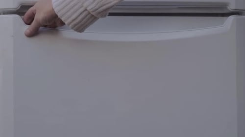 Opening door of an empty refrigerator freezer compartment