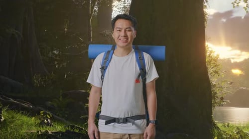 Asian Male Smiling To Camera While Exploring Nature