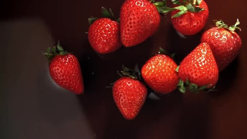 Luscious Strawberries Falling into Chocolate Splash
