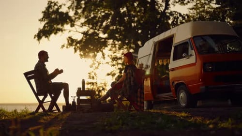 Calmness and Relaxation in Nature Campers Traveling Across Country By RV Silhouette View of Two