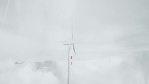 Windmills Hidden In Dense Morning Fog At Cloudy