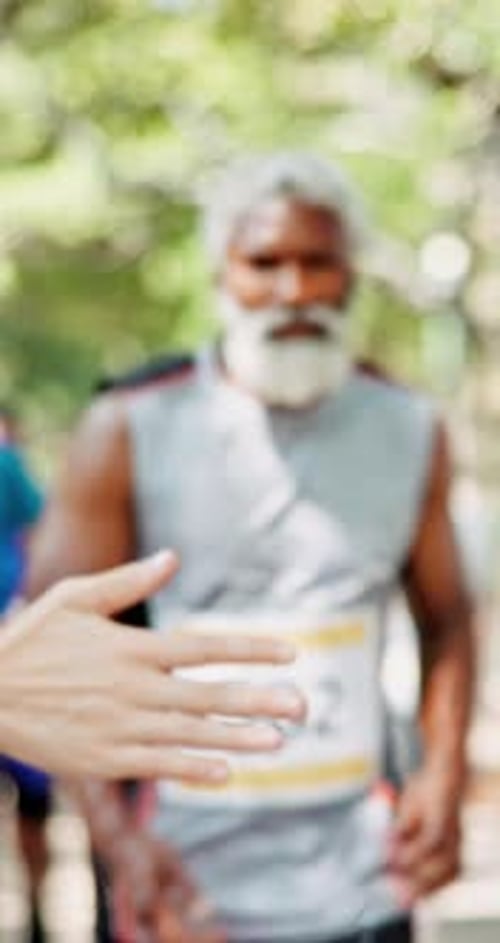 Running, marathon and high five with people in city for success, fitness challenge and workout