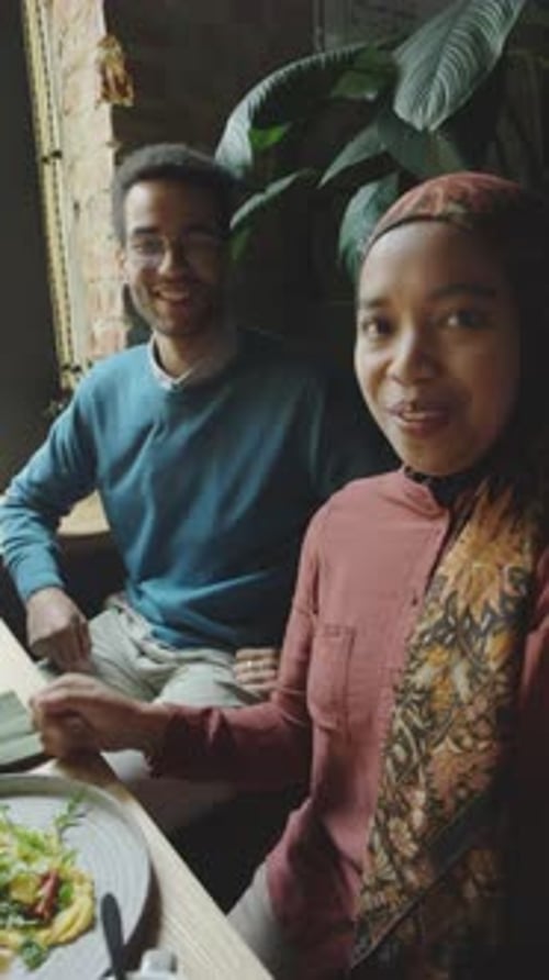 Muslim Couple Vlogging on Dinner in Cafe