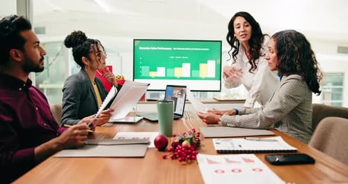 Team Collaborate in Office Conference Room with Graph