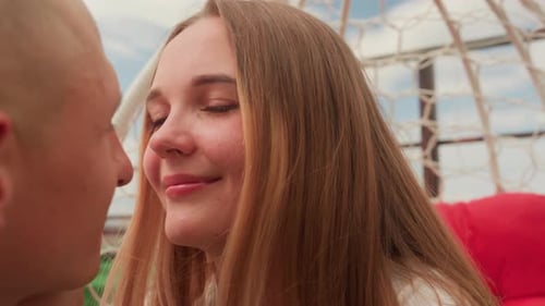 Affectionate couple kissing in urban outdoor setting