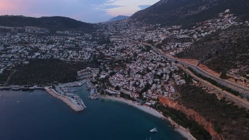 Charming Turkish Coastal Town Nestled Among Hills and Serene Blue Waters