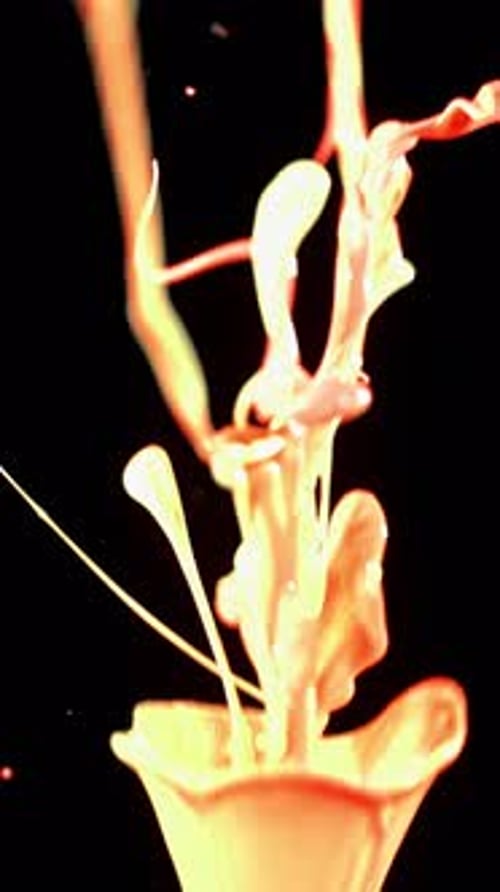 Abstract Paint Streams Against Black Backdrop