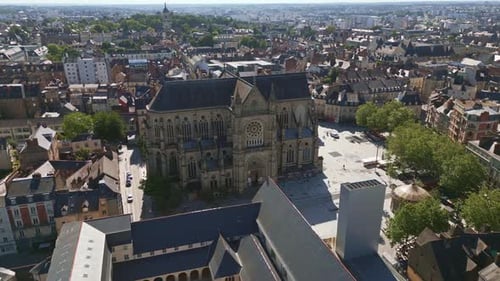 Basilica Saint-Aubin in Place Sainte Anne square, Rennes in France. Aerial forward
