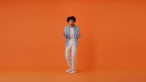 Surprised Guy Gesturing with Delight and Amazement in Studio