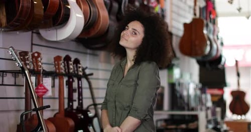 Portrait of a small business owner in a guitar store