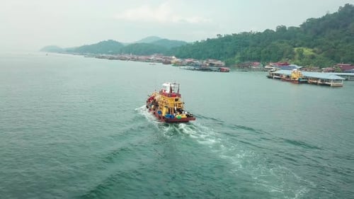 Fishing boat returns to Pangkor Island aerial view, Malaysia