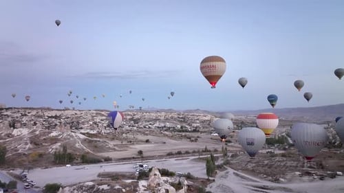 Hot Air Balloons Floating Over Cappadocia Landscape