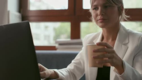 Business Worker Sits at Table of Office Workplace. Remote Work and Online