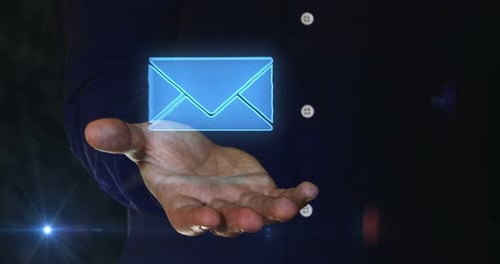 Envelope email symbol over hand