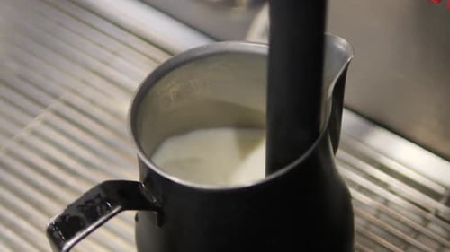 Frothing Milk With Steam Wand From Espresso Close Up