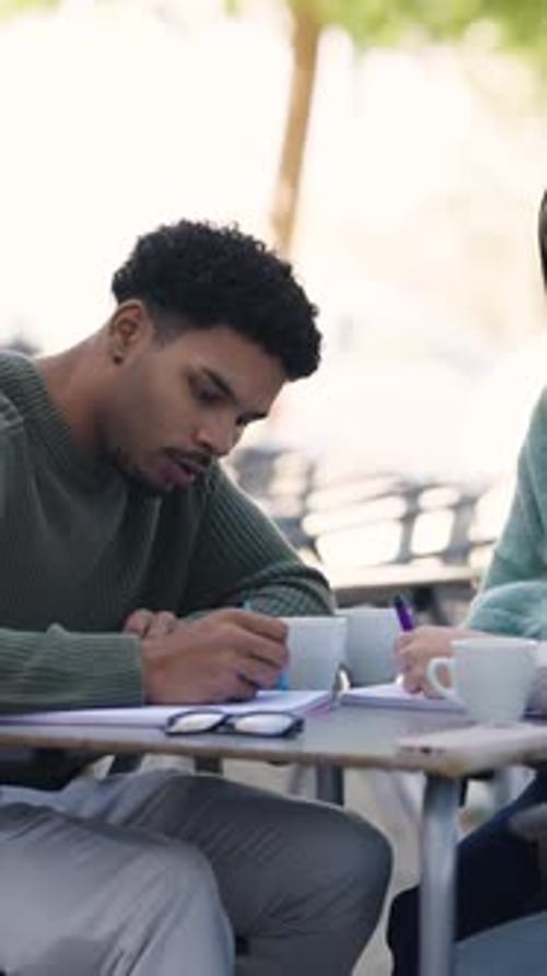 University Students Collaborating on a Project Outdoors Vertical