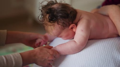 Baby Receives Treatment from Healthcare Professional Indoors