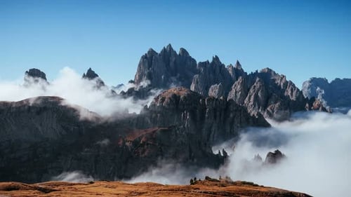 Mountains Above the Clouds on a Bright Day