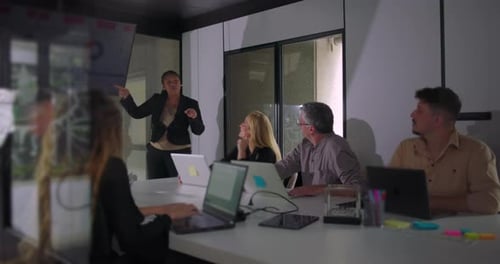 Engaged Office Team Discussing Data Presentation