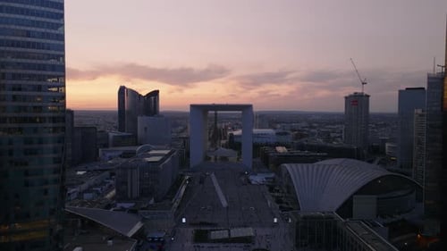 Aerial View of Popular Modern Design Grande Arche De La Defense Against Sunset Sky Backwards Reveal