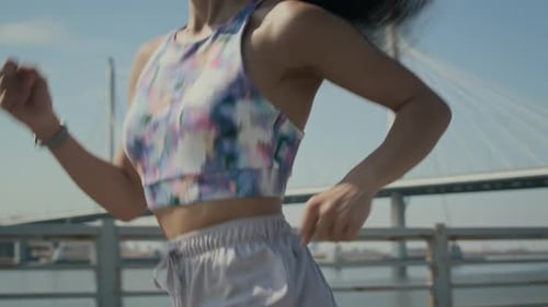 Young Adult Woman Running Outside in the City