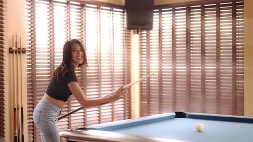 Woman Smiling And Ready To Take A Pool Break Shot