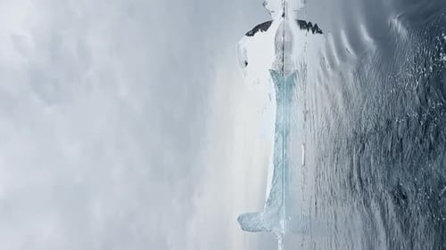 A Huge High Breakaway Glacier is Passing By in the Southern Ocean Off the Coast of Antarctica the