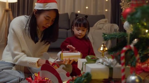 Family Celebrates Christmas in Cozy Home at Night